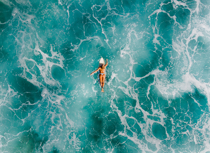 Frothy Surfer Girl Drone Shot